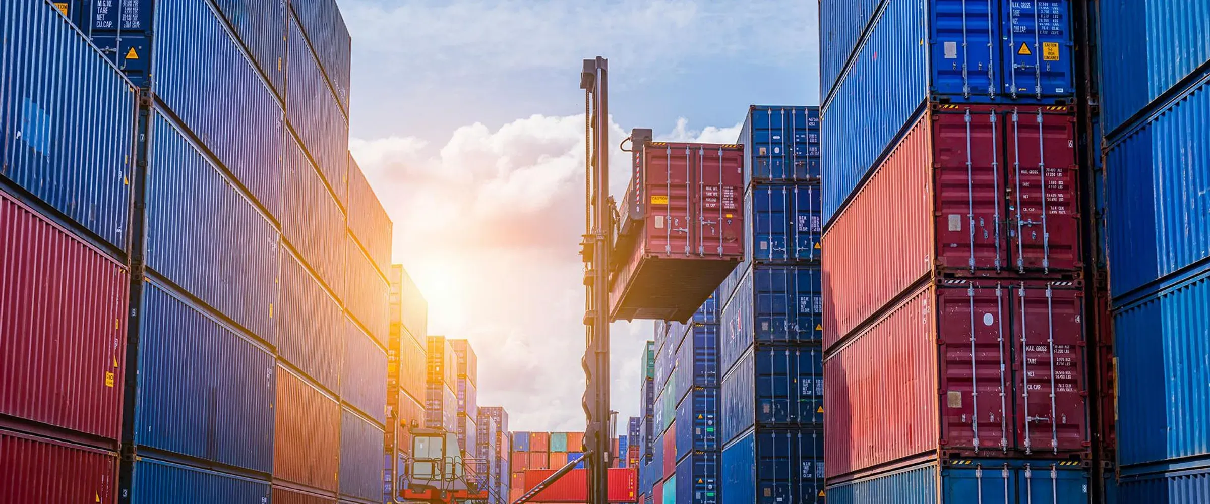 Forklift extracting a container from a container yard