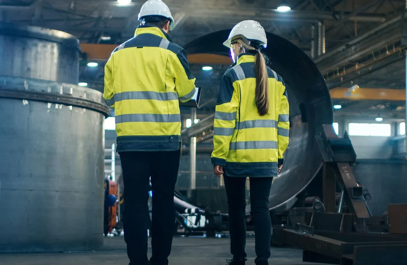 Workers discussing specs of a build for Mk2 Recruitment