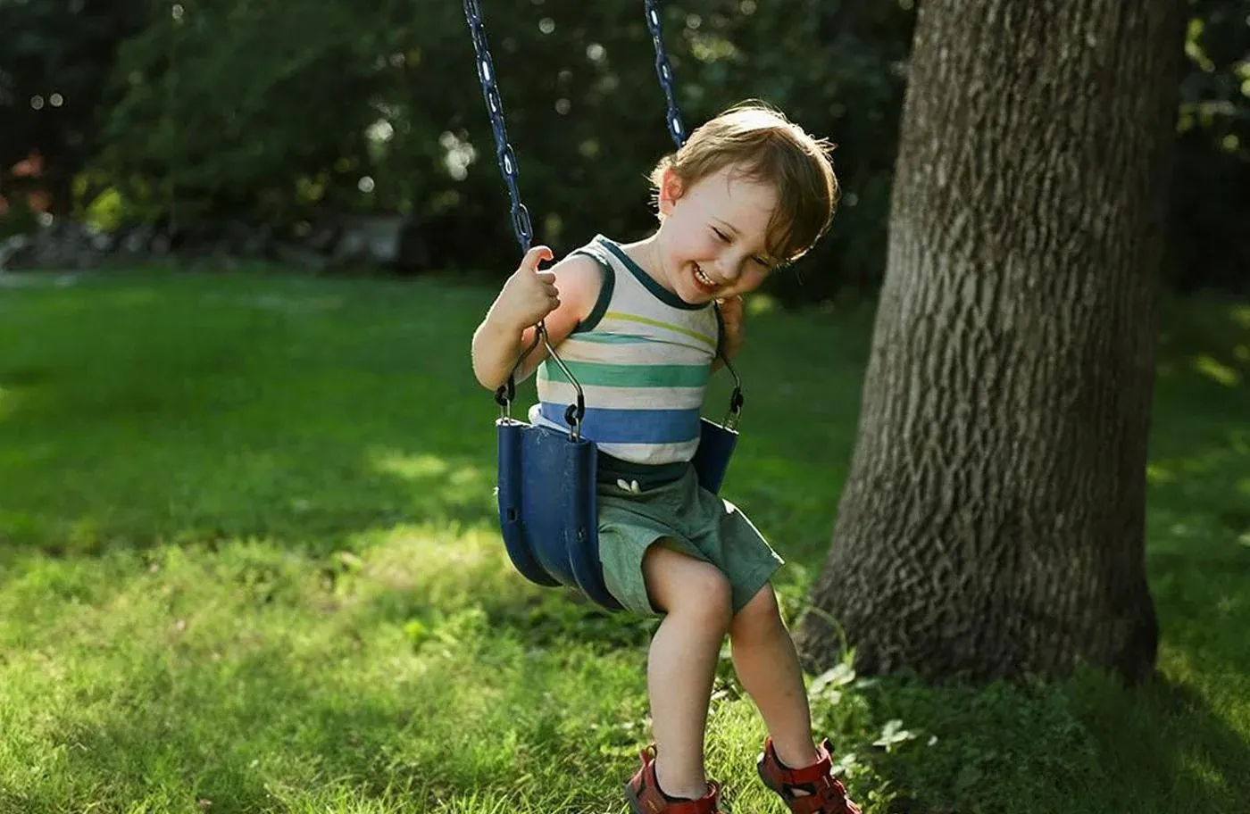 Child enjoying a swing at a park at Mooringe Mews